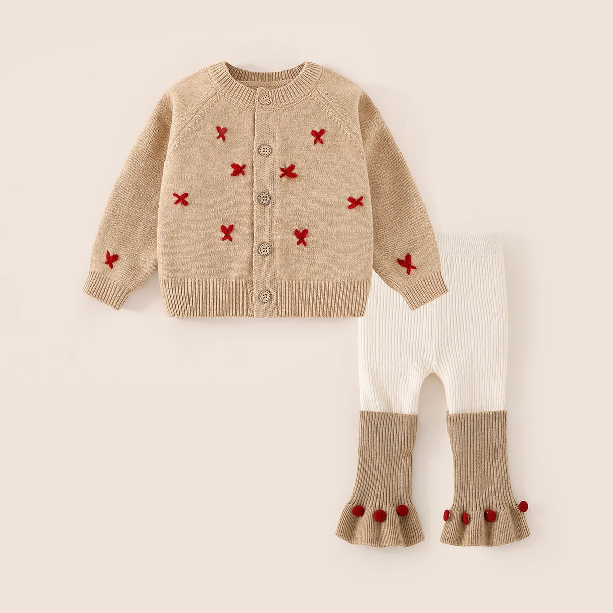 Girls camel knit cardigan with red cross-stitches and cream flare leggings set, flat lay