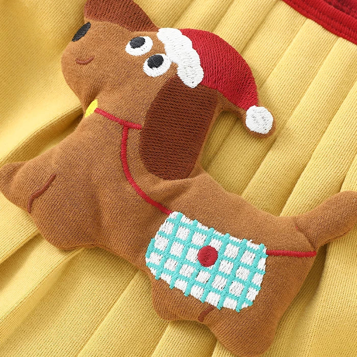 Embroidered plush puppy with a red hat on the mustard overall romper
