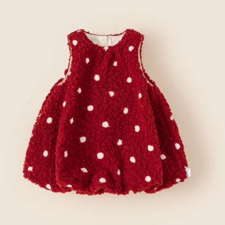 Girls red polka dot sherpa pinafore dress on a cream background
