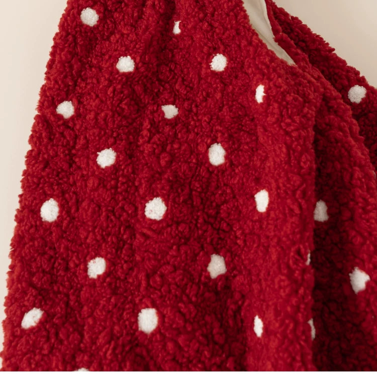 Close-up of the fluffy red teddy fleece with white polka dots