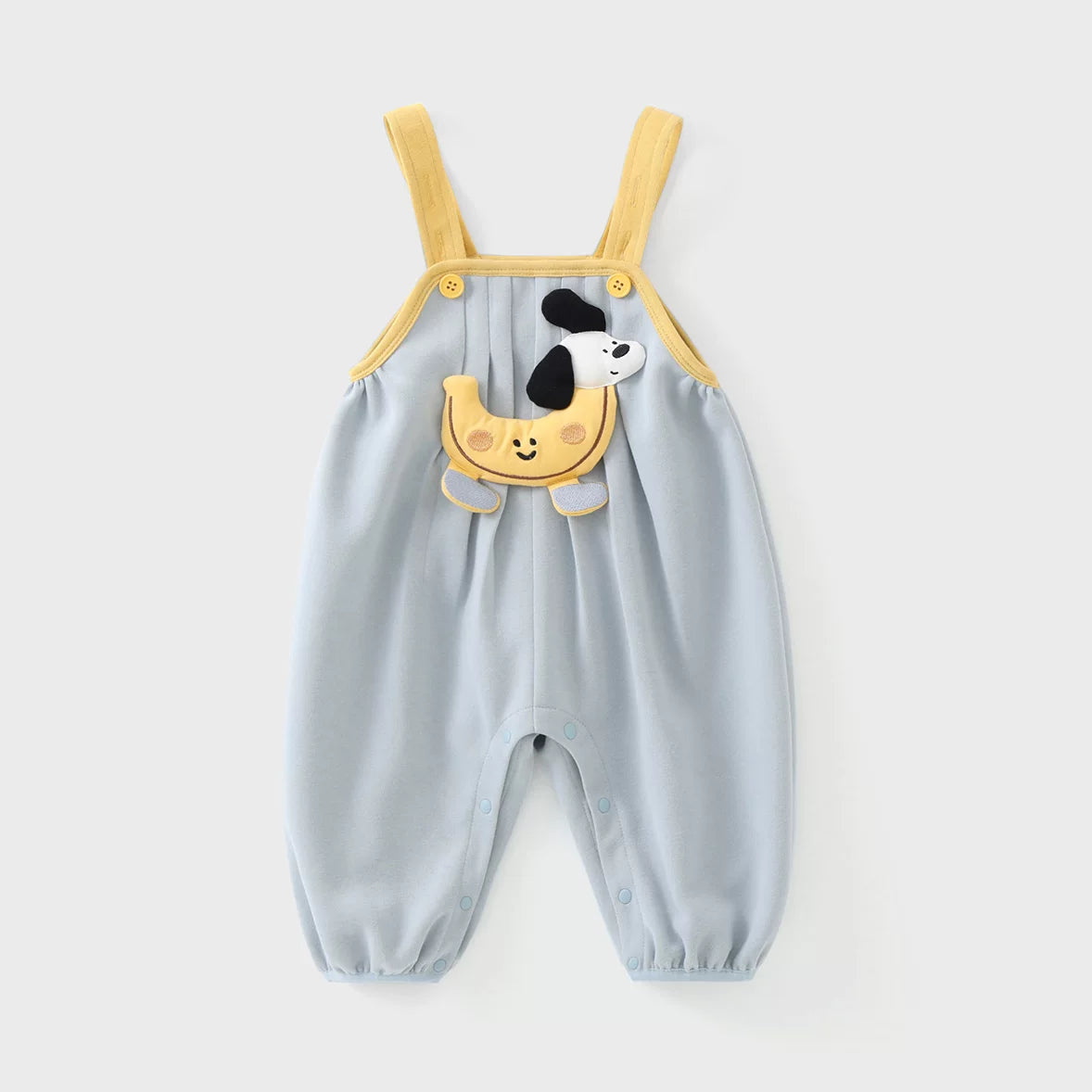 Dusty blue baby overall romper with yellow straps and puppy appliqué, flat lay