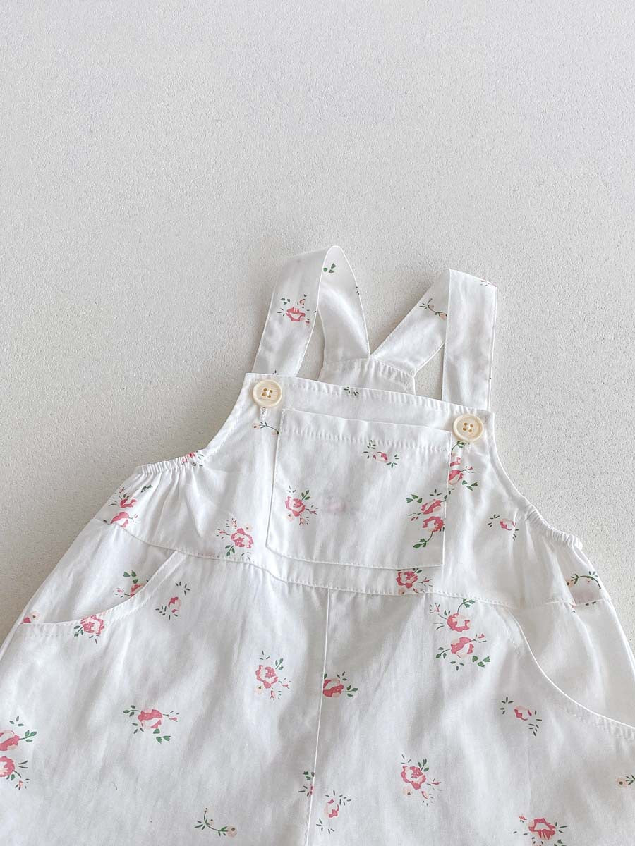 White floral print baby overalls front pocket and button strap detail