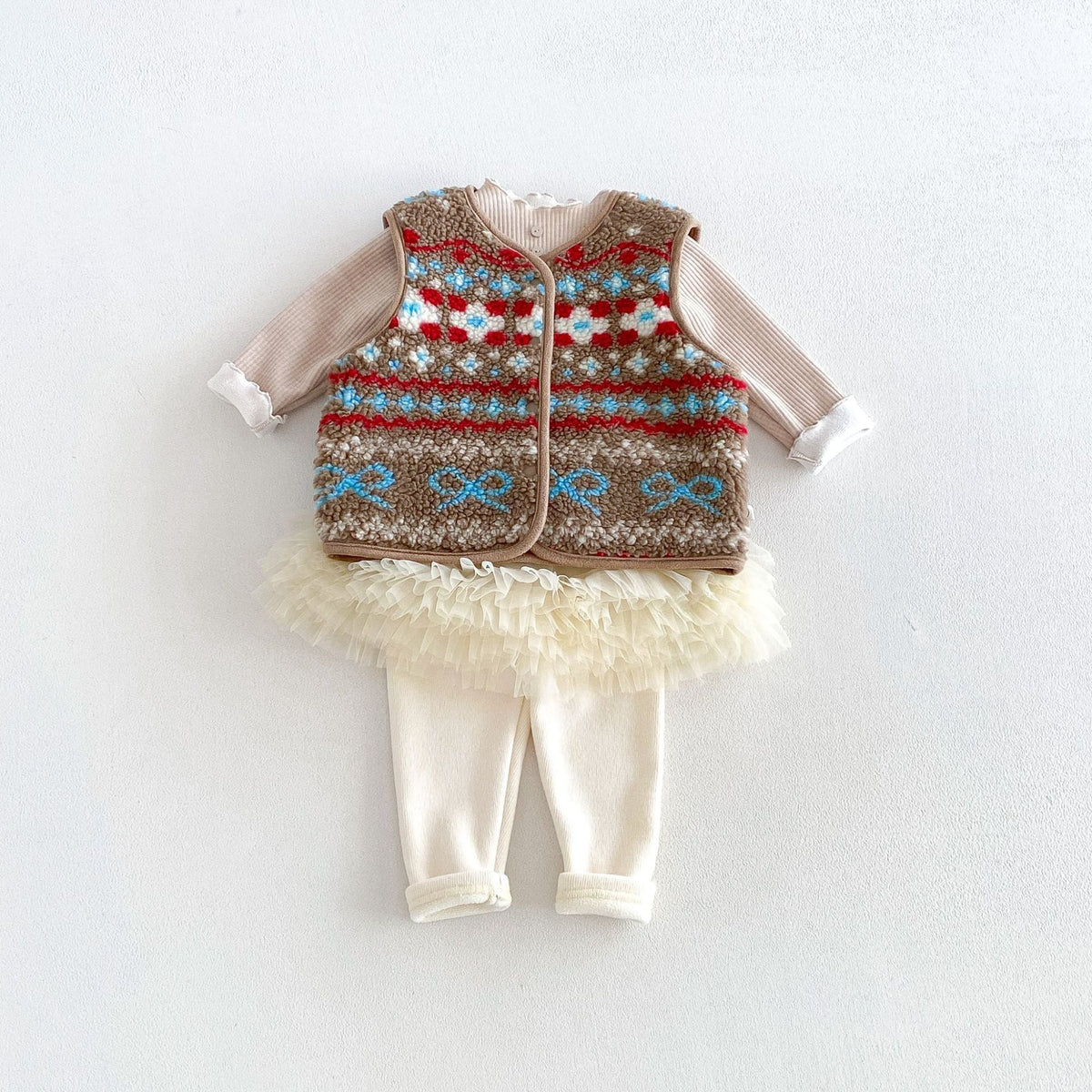 Cocoa fair isle fleece vest styled with a tutu and leggings (sold separately)