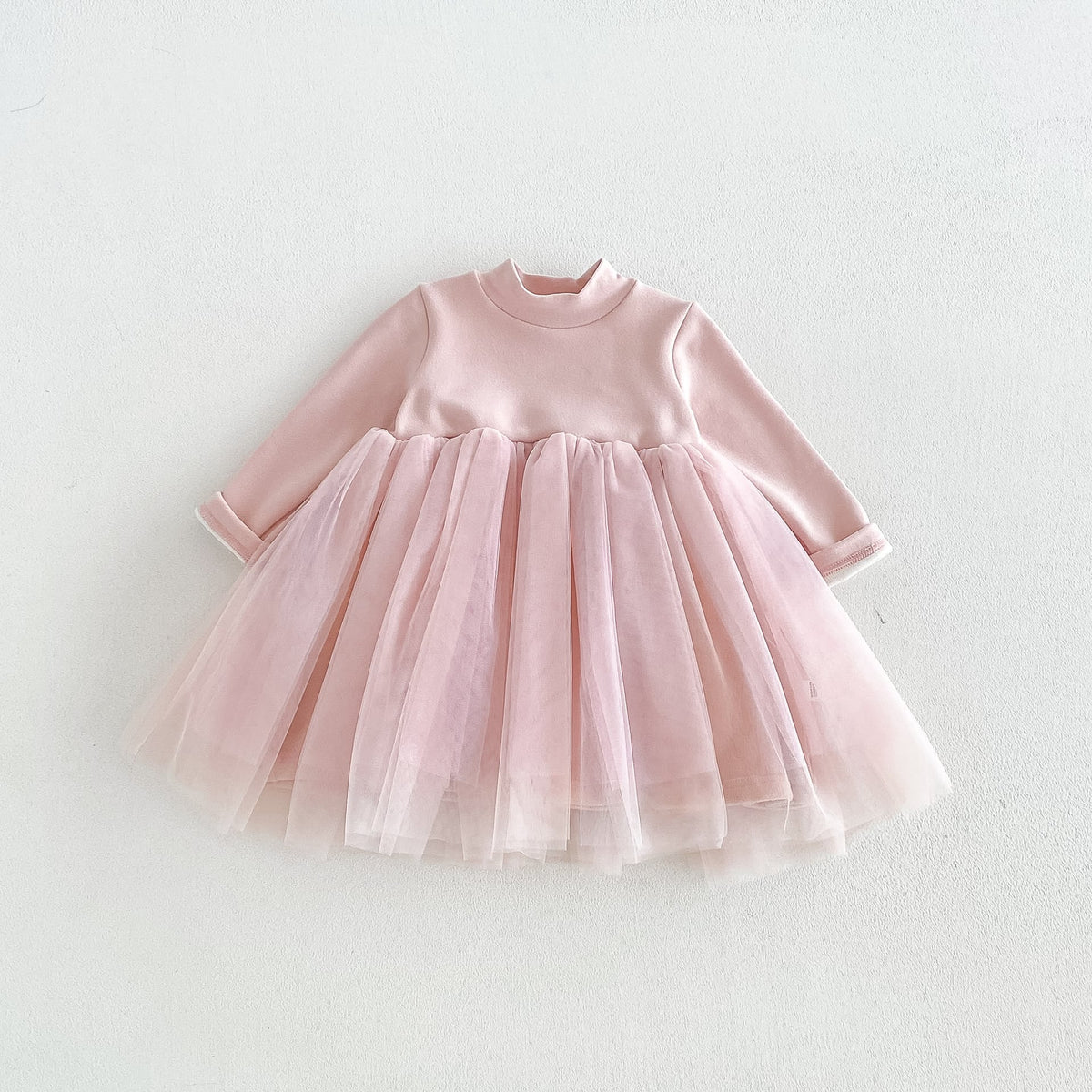 Blush pink long-sleeve tutu dress for girls, flat lay