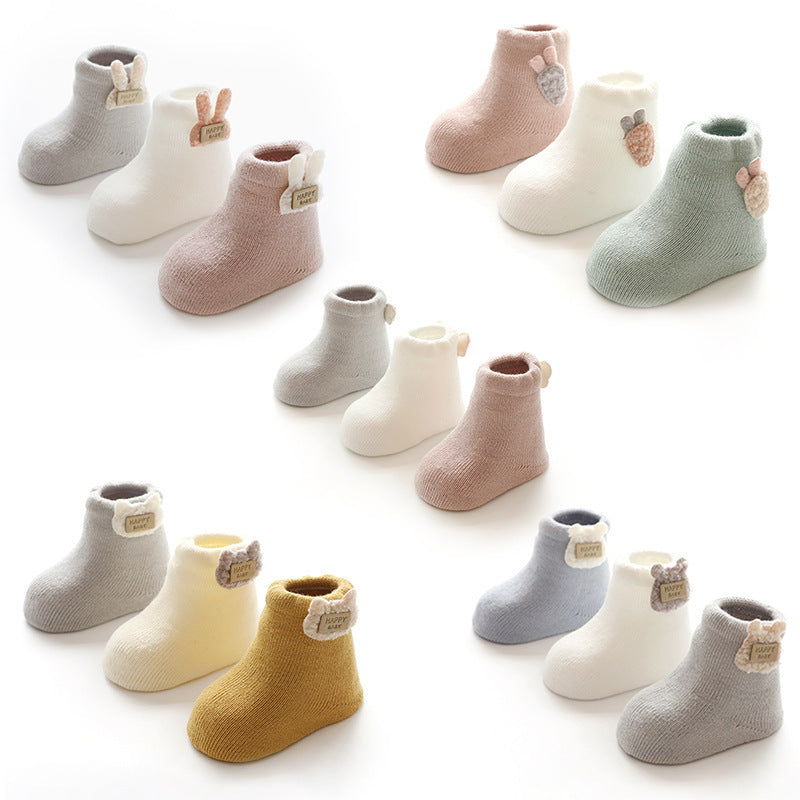 All styles of animal tag baby socks laid out