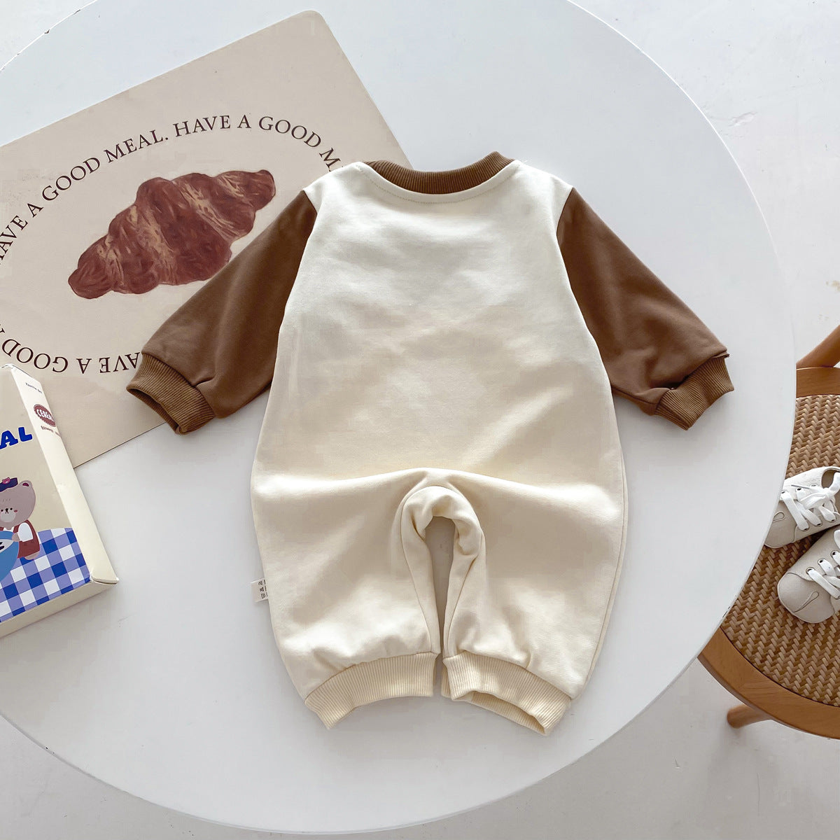 Apricot bear jumpsuit laid flat