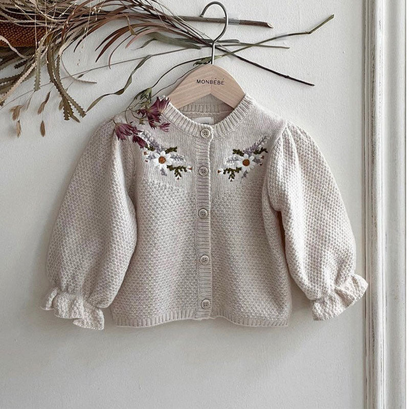 Apricot knit baby cardigan with floral embroidery