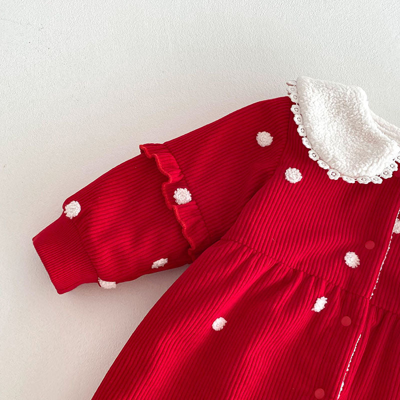 Ruffle sleeve detail on red polka dot jumpsuit