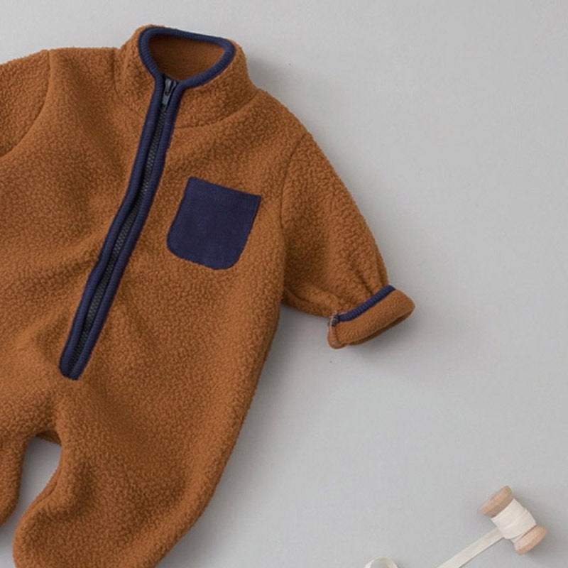 Close-up of brown sherpa jumpsuit with navy pocket