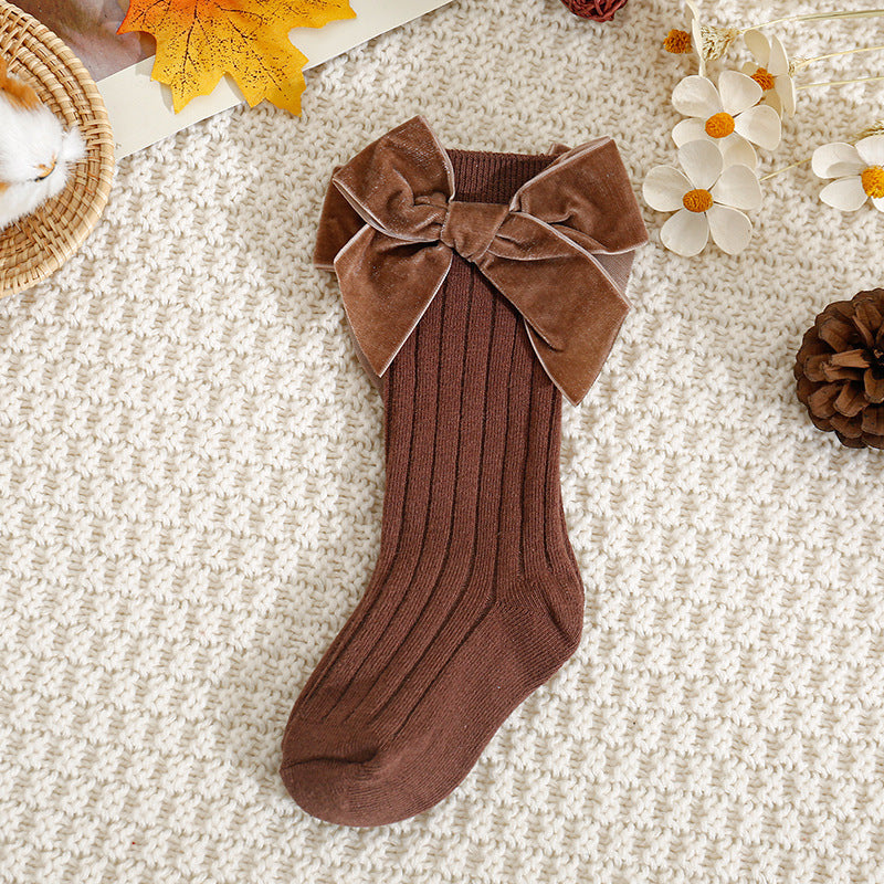 Brown ribbed knee-high baby socks with velvet bow