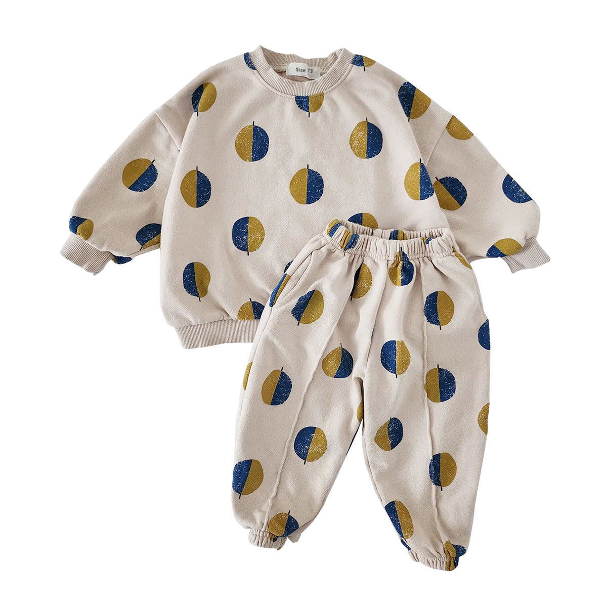 Beige toddler pajama set with half-moon dot print