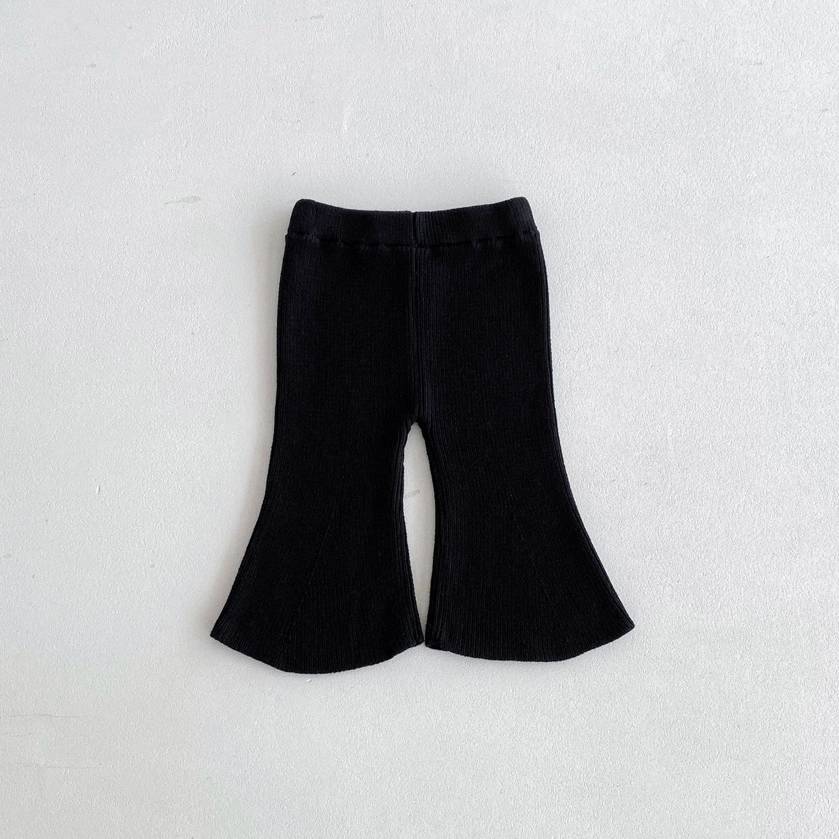Black ribbed flared knit trousers for baby girl