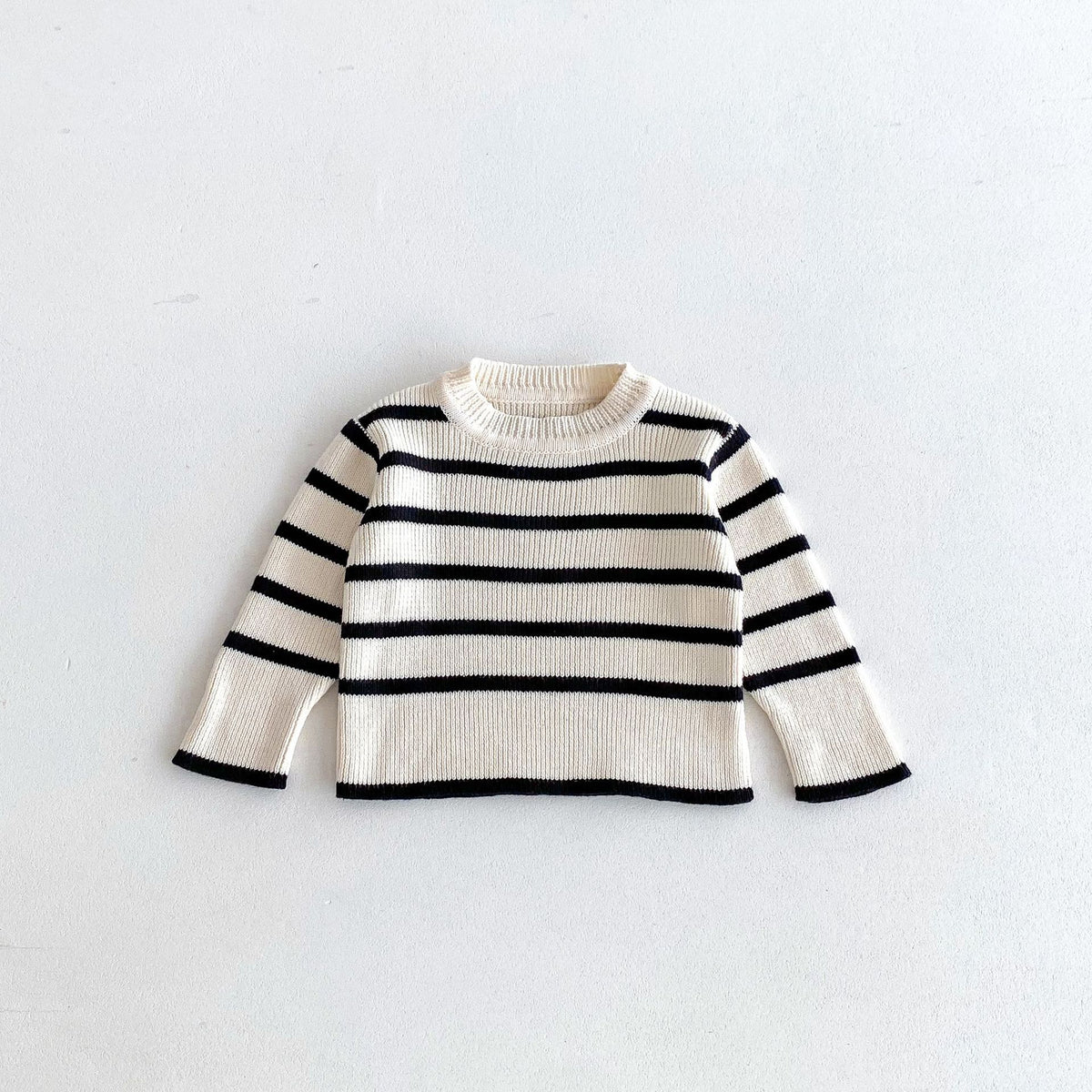 Black and white striped knit baby sweater