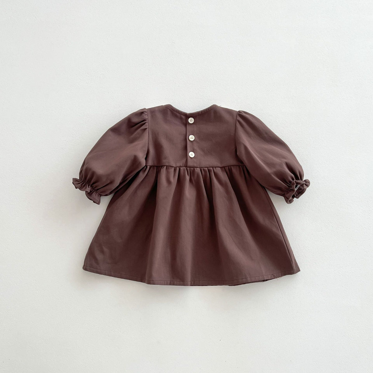 Back view of brown corduroy dress