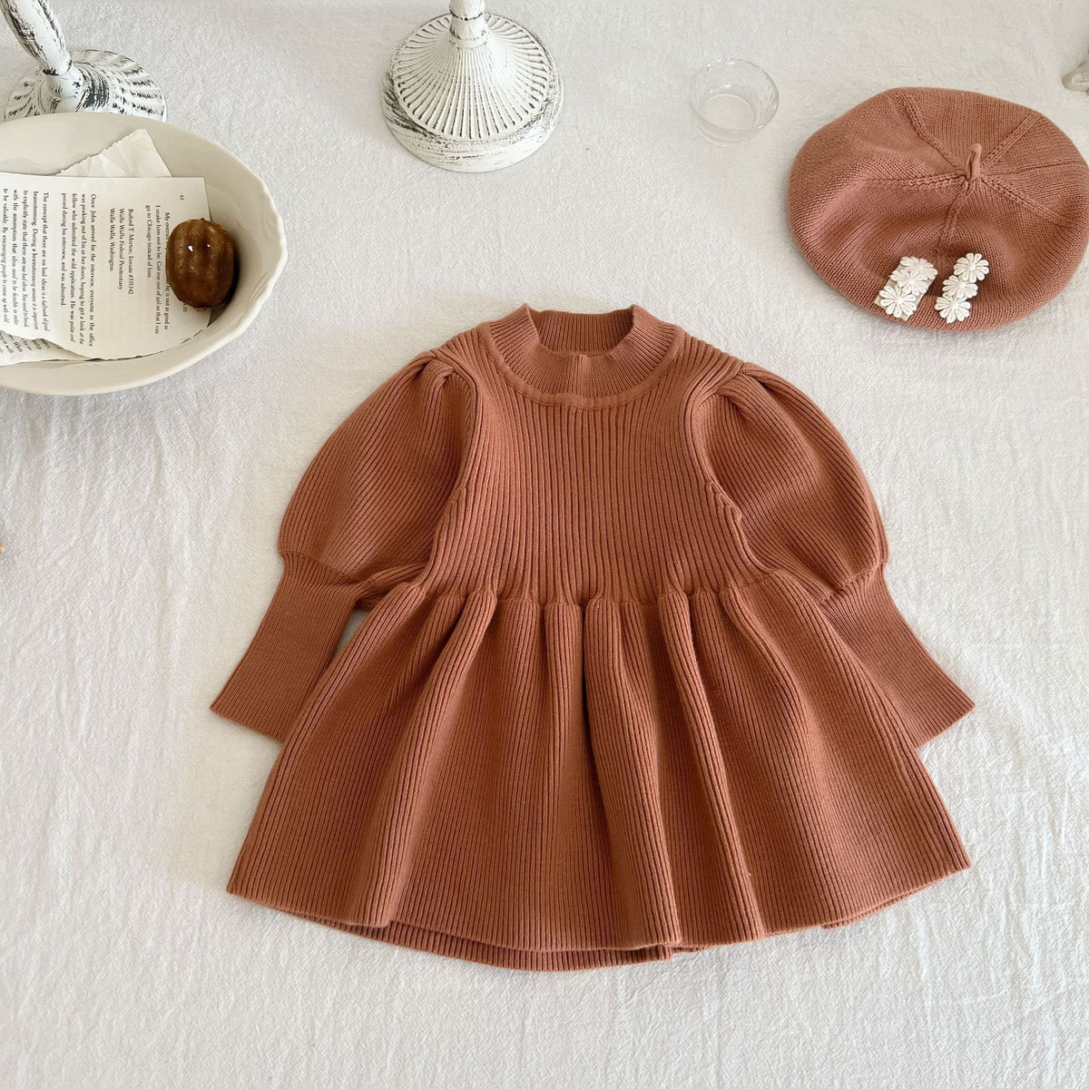 Brown knit skater dress with puff sleeves