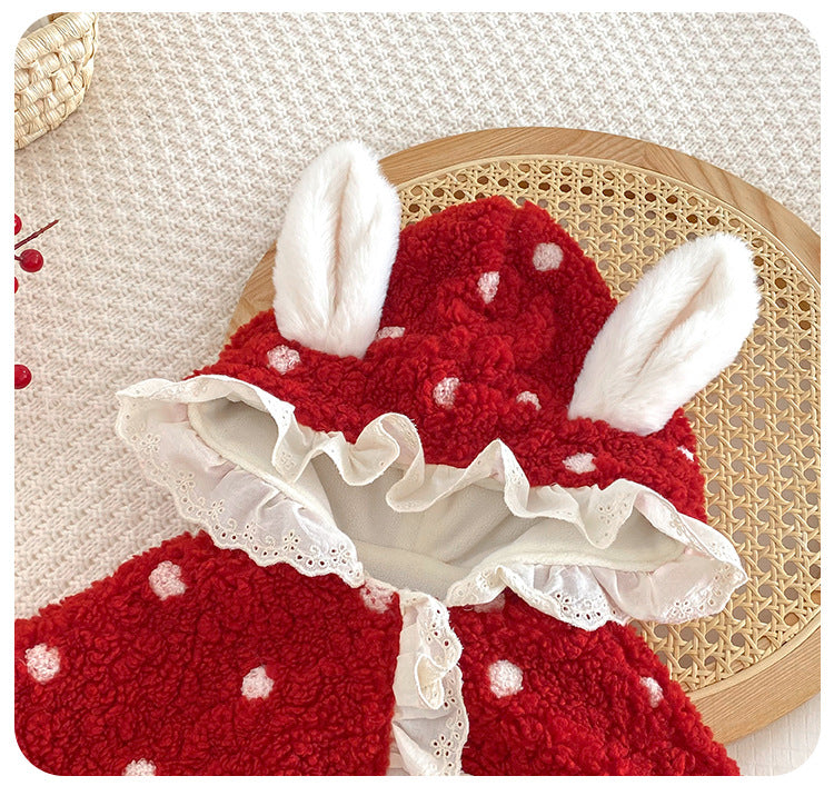 Close-up of bunny ears and ruffle trim on red baby cape hood