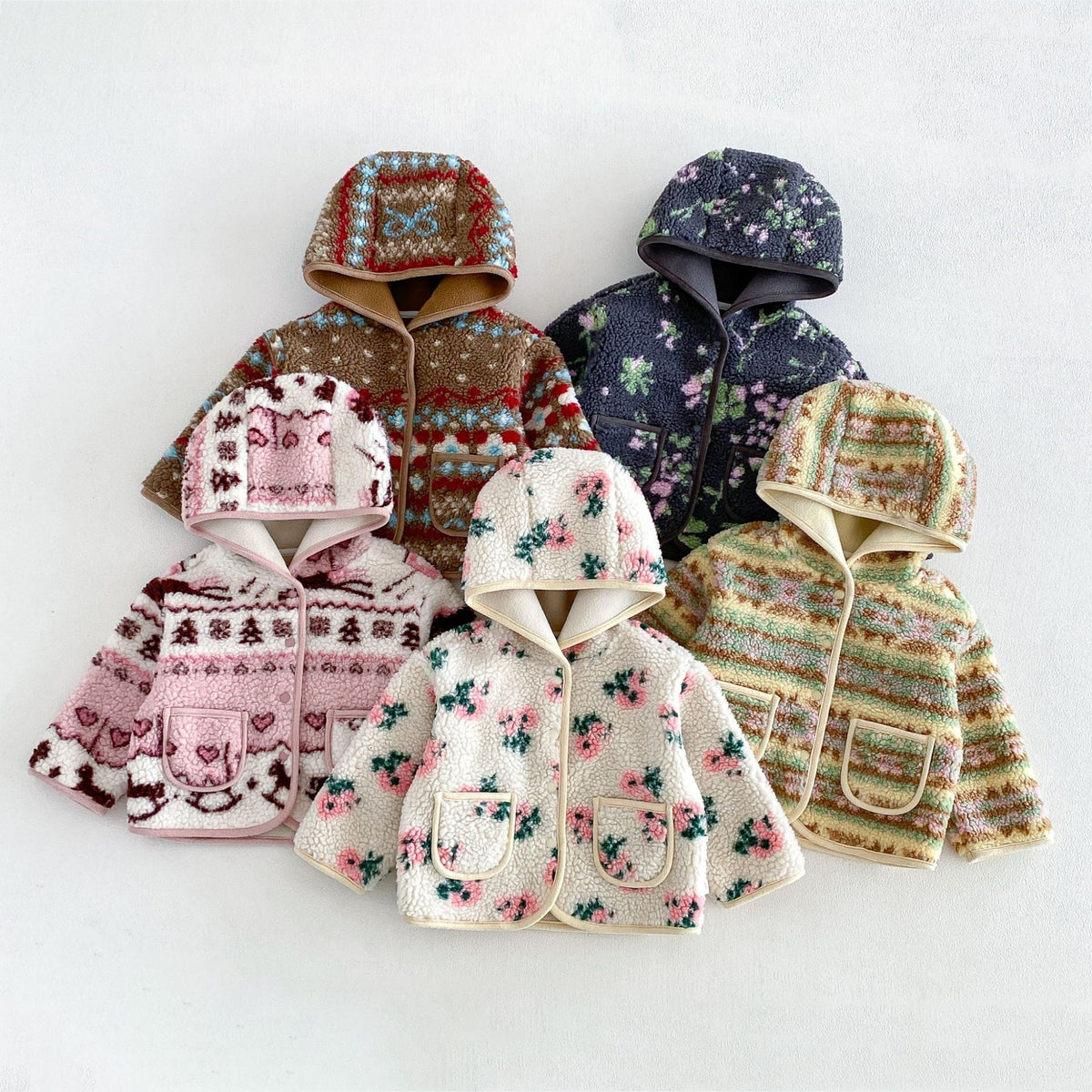 All five hooded sherpa jackets laid together