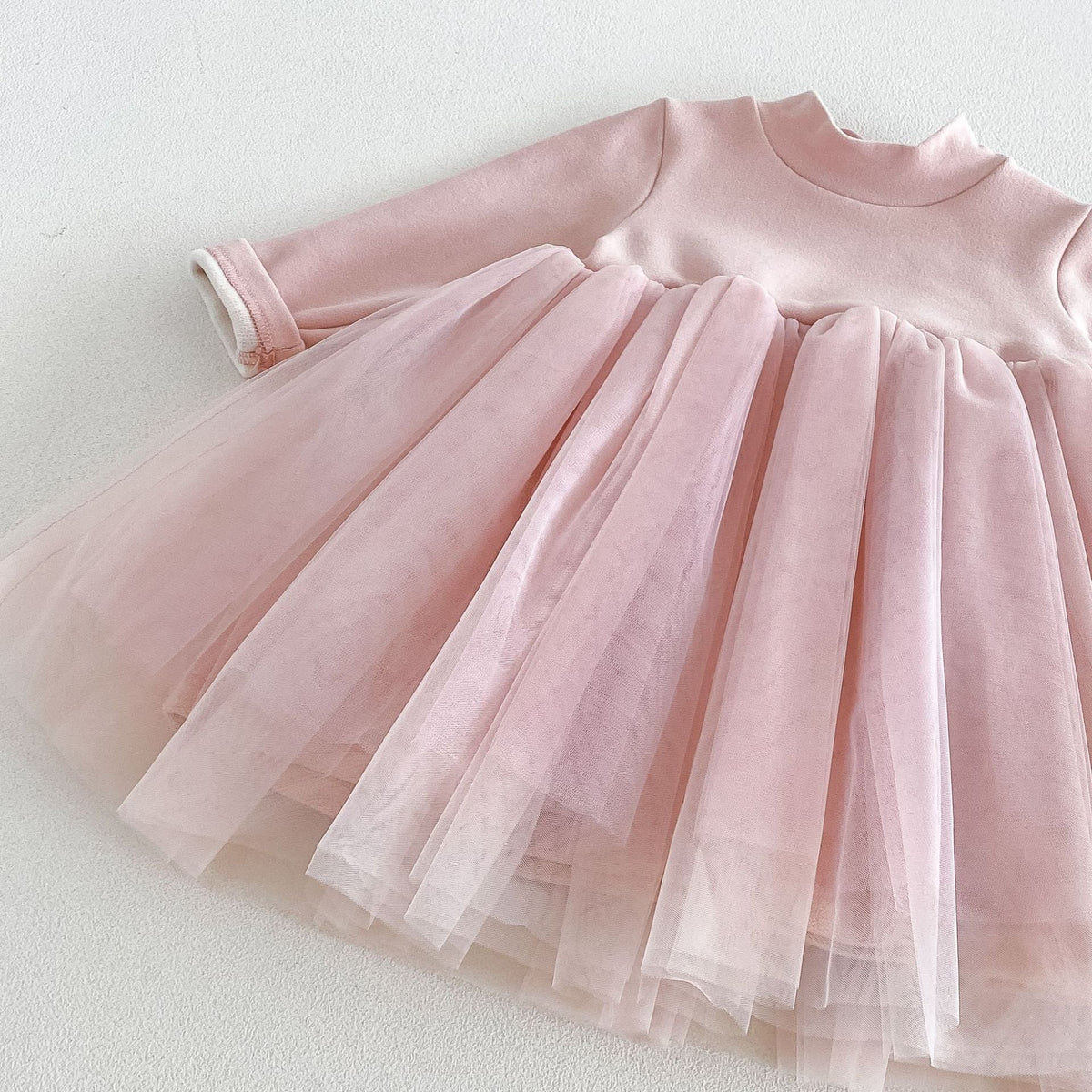 Blush tulle skirt detail with layered, twirly hem