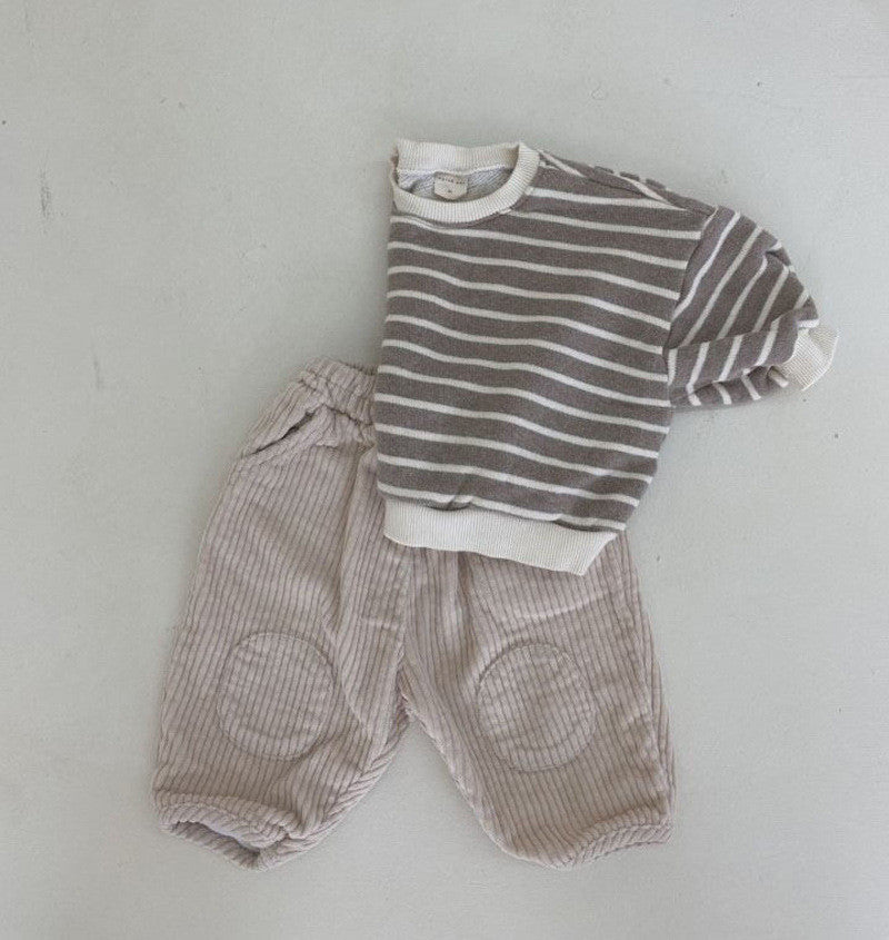 Carrot pants with striped top laid flat