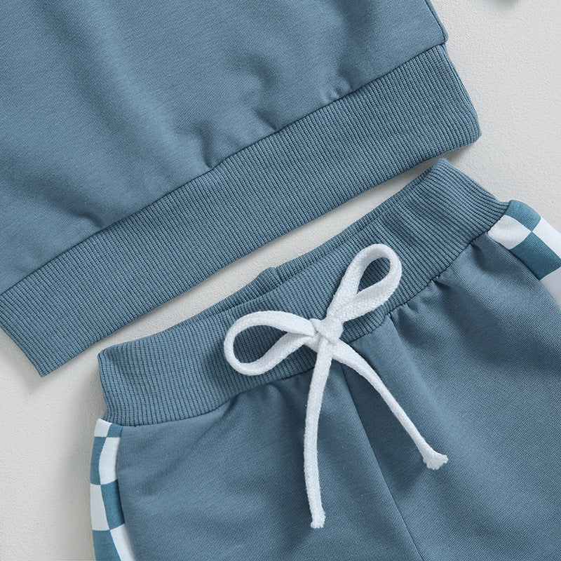 Close-up of joggers drawstring and checkerboard stripe