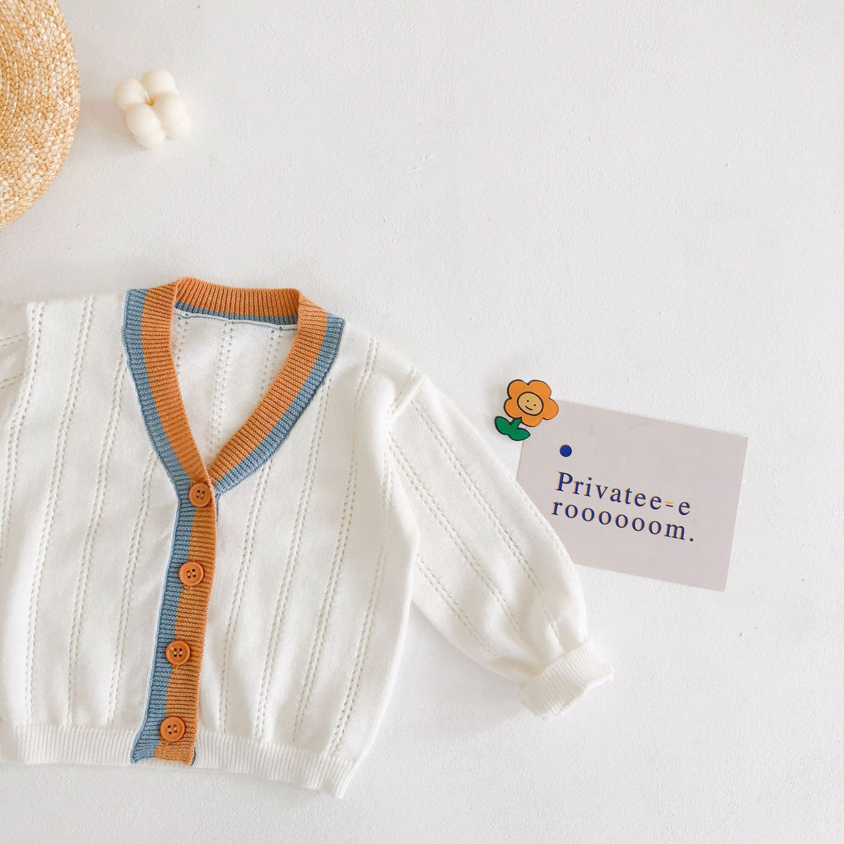 White cardigan with contrast V-neck trim