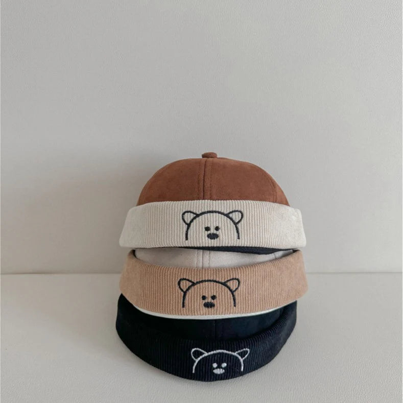 Brown, beige and black corduroy baby hats with bear embroidery
