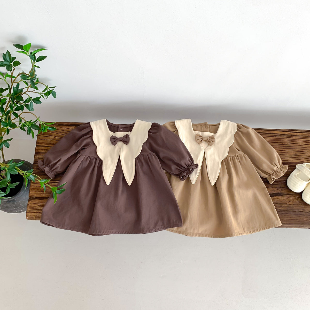 Brown and light brown dresses on a table