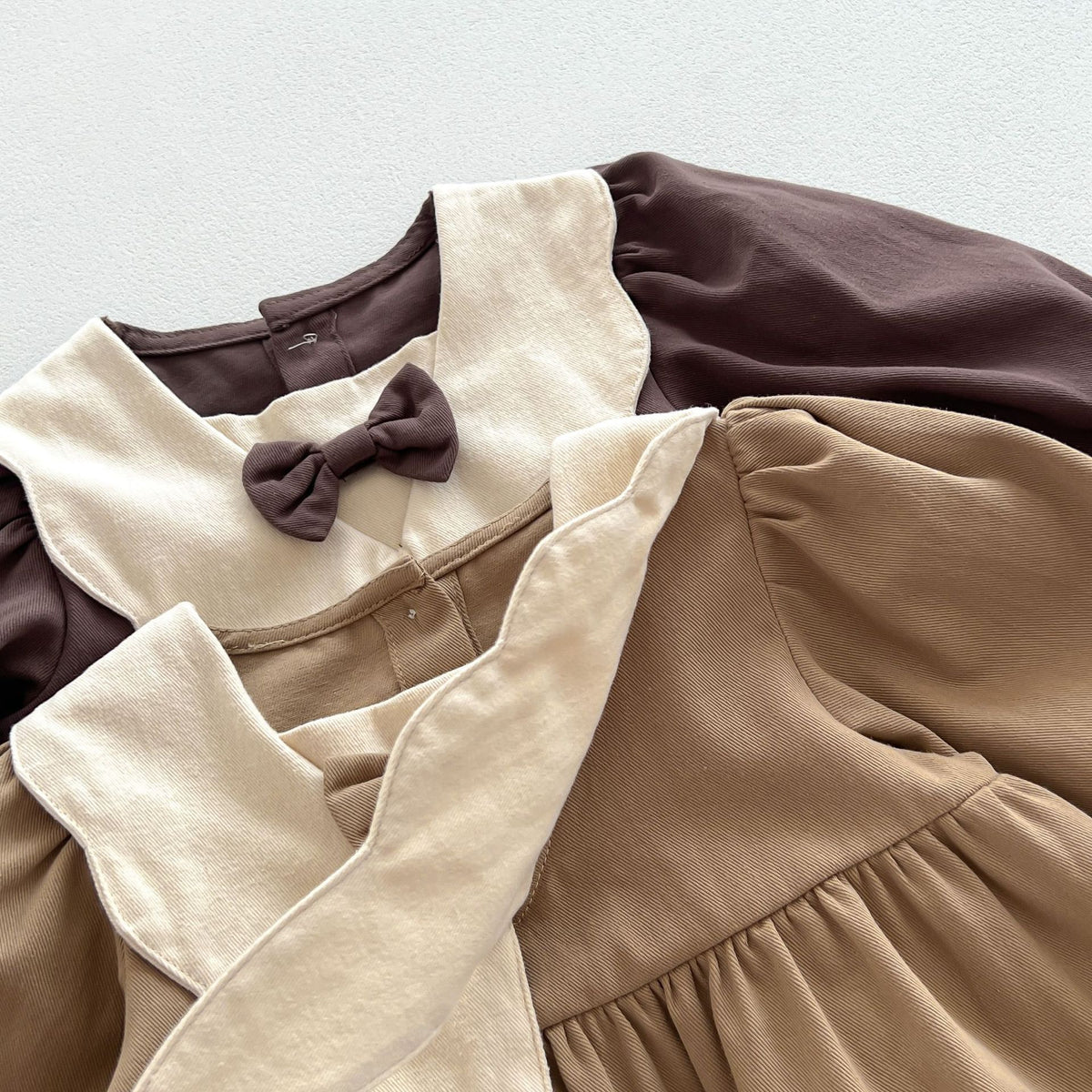 Close-up of cream collar and bow