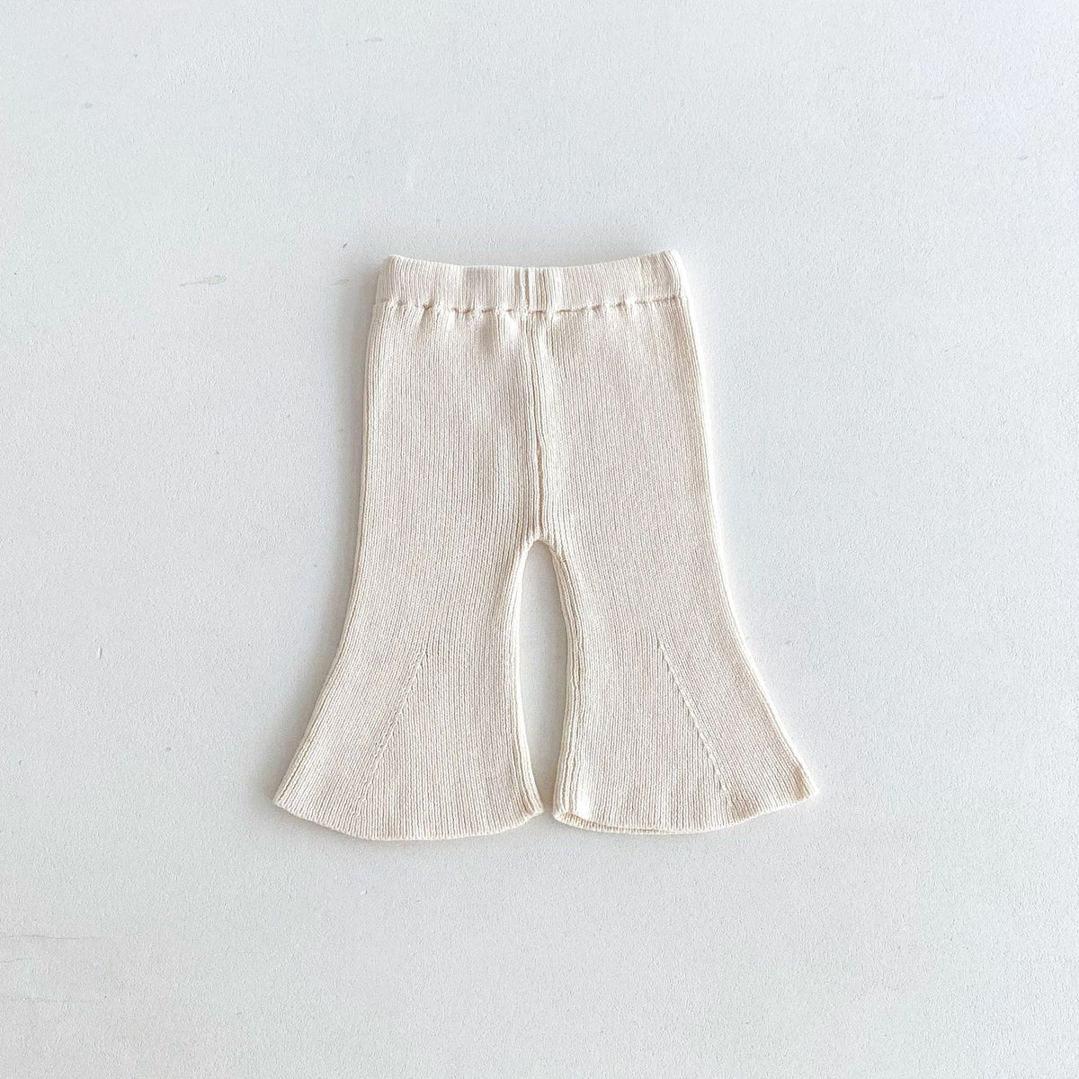 Cream ribbed flared knit trousers for baby girl