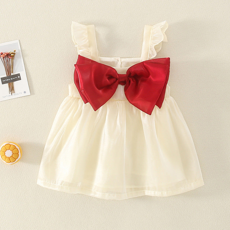 Cream tulle dress with big red bow and flutter sleeves