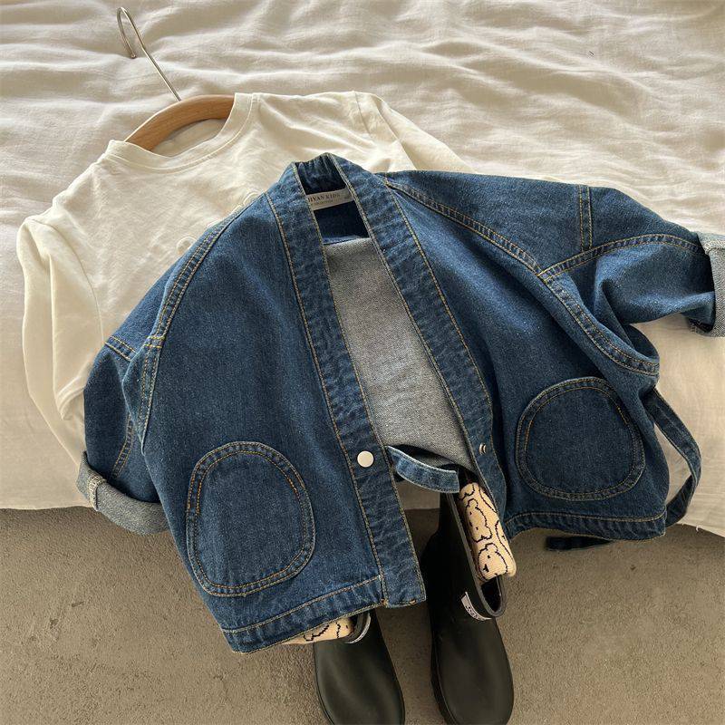 Denim wrap jacket on a hanger with shoes