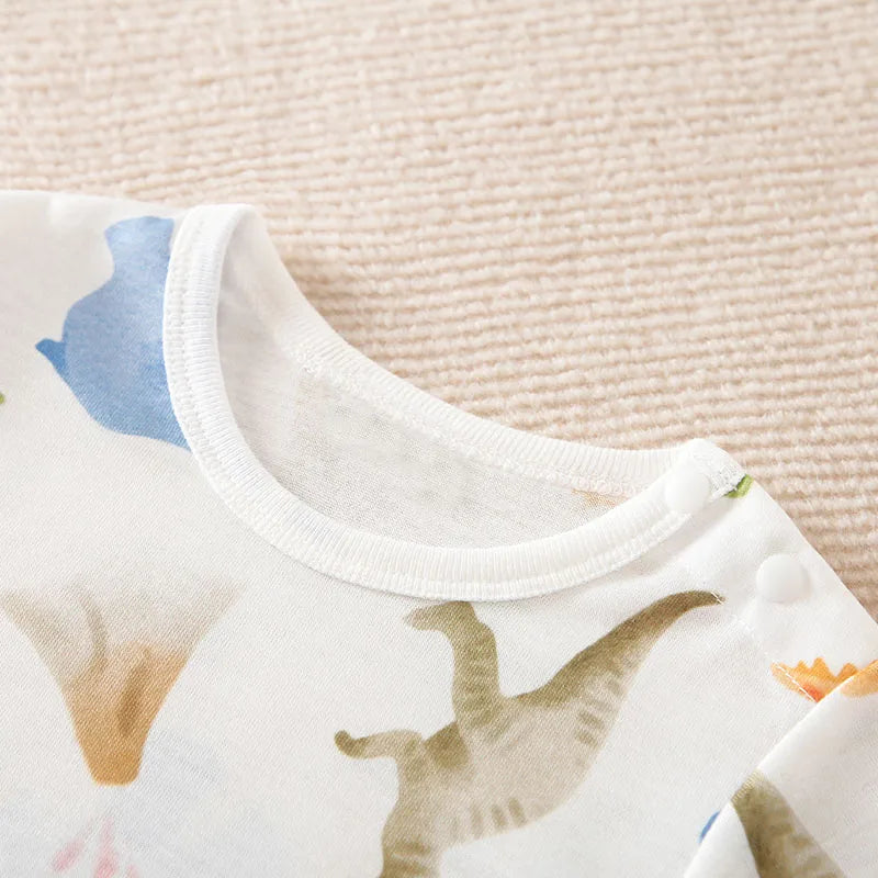 Close-up of neckline on dinosaur print romper