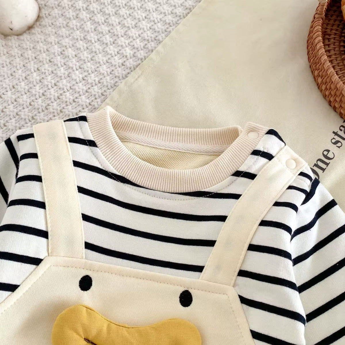 Close-up of smiling duck face on romper bib