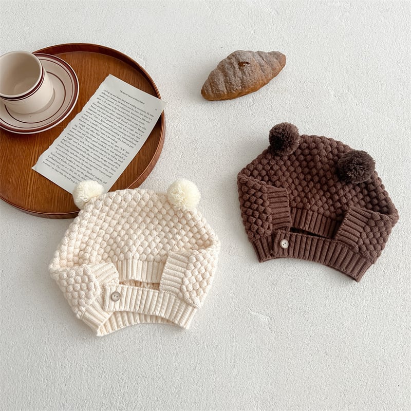 Cream and brown bubble-knit bear hats with pom-pom ears