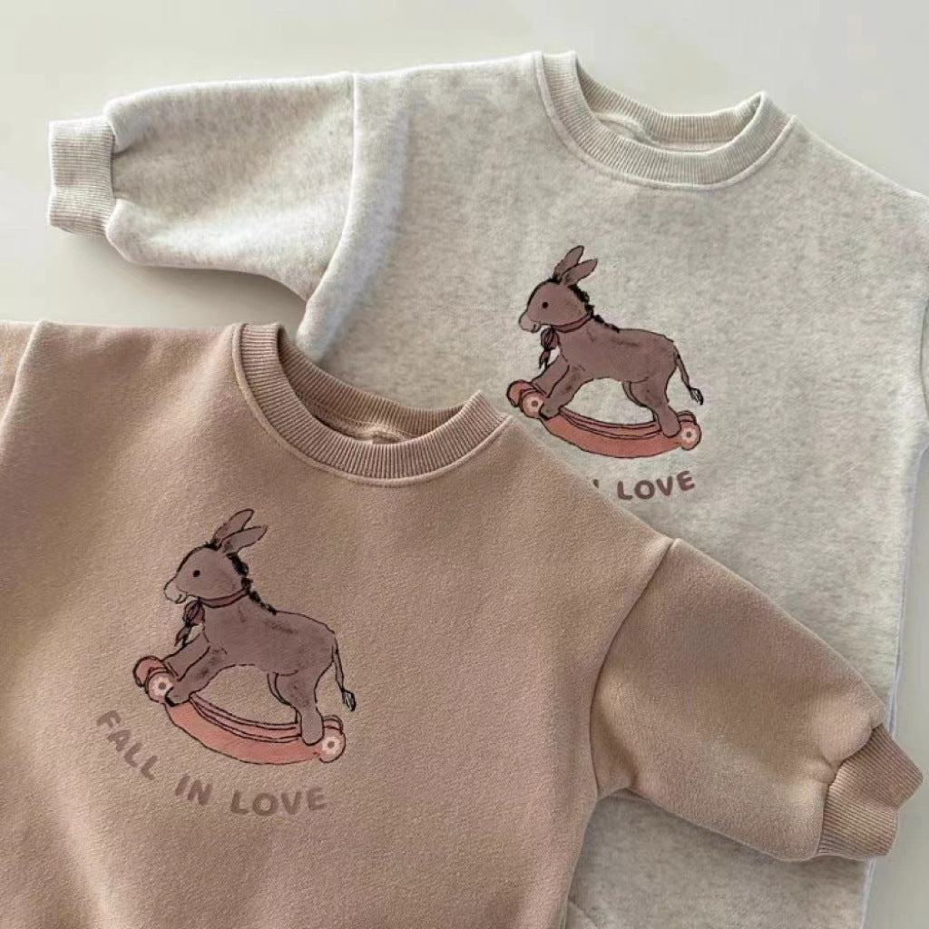Close-up of rocking horse Fall in Love print on baby rompers