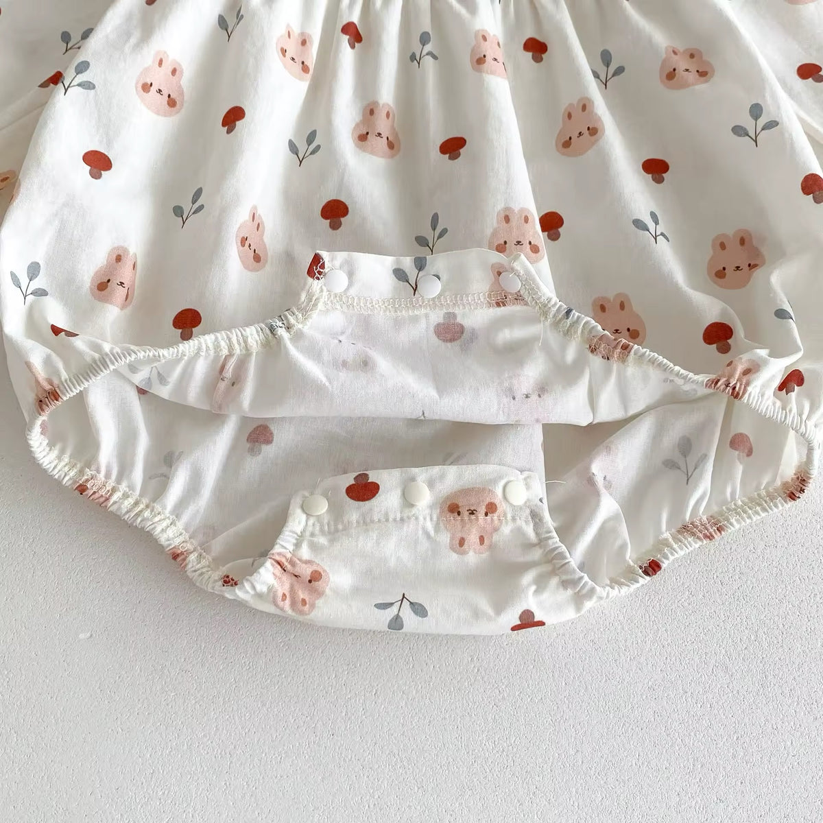 Snap closure at the bottom of floral baby romper