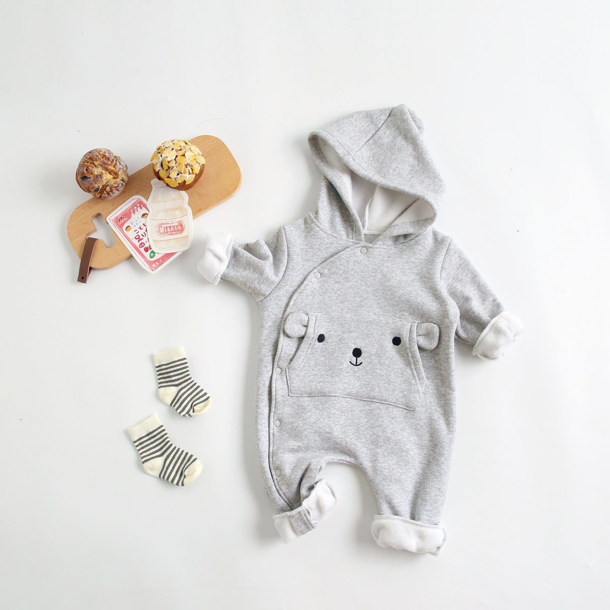 Gray bear hooded jumpsuit styled with socks