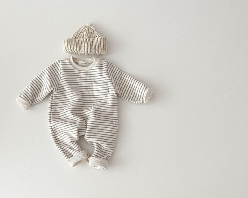Gray striped baby romper styled with beige beanie
