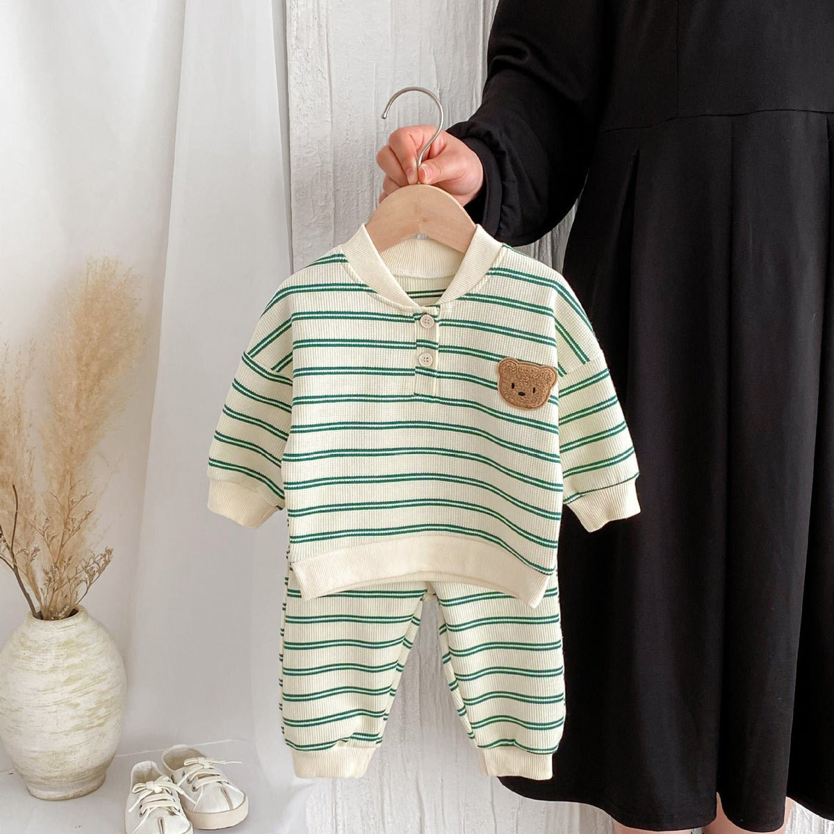 Green striped bear set held on a hanger