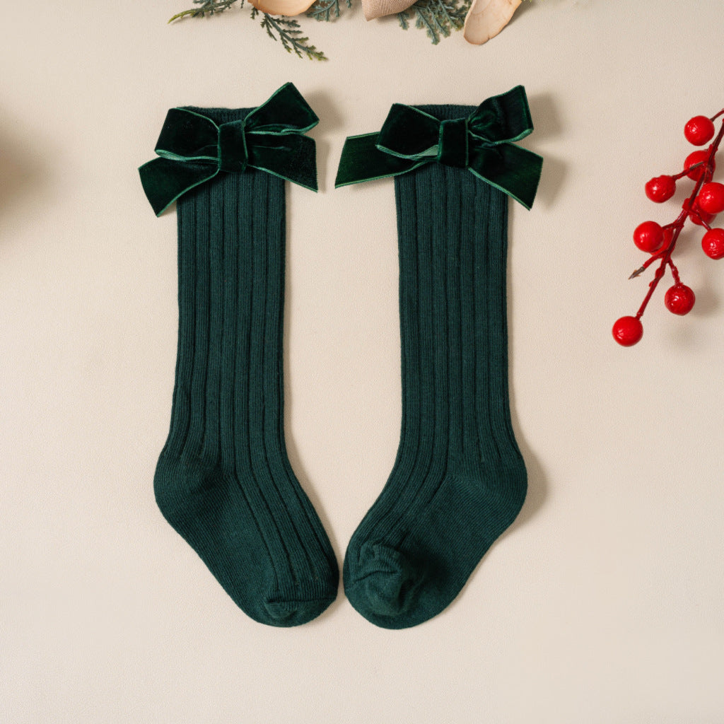 Green ribbed knee-high socks with velvet bows
