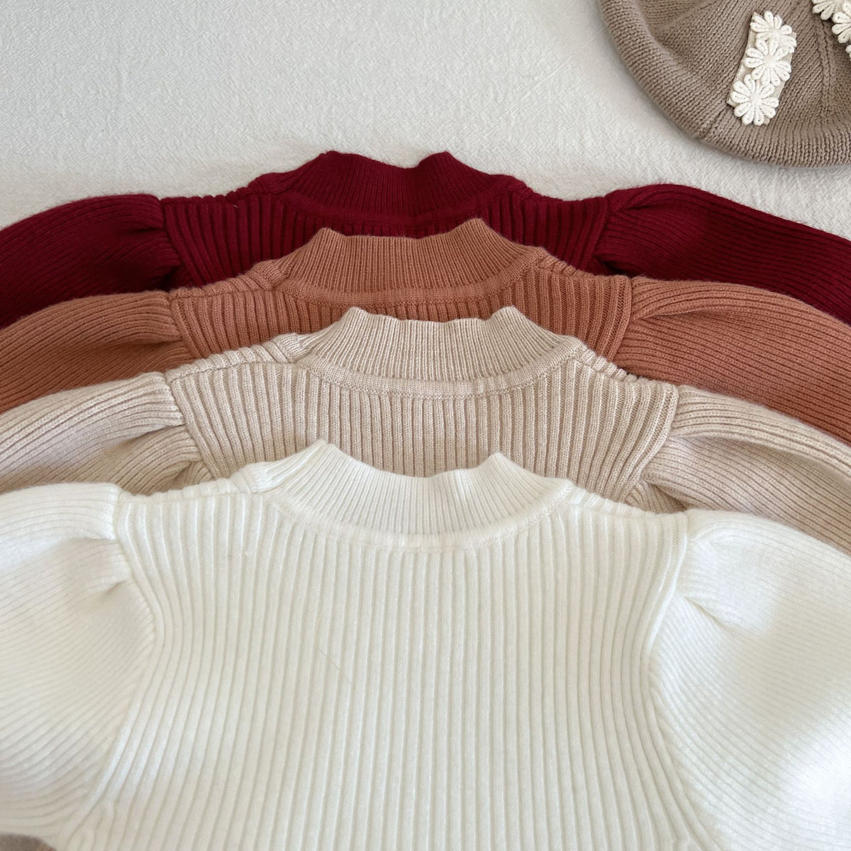 Stacked knit dresses showing ribbed bodices