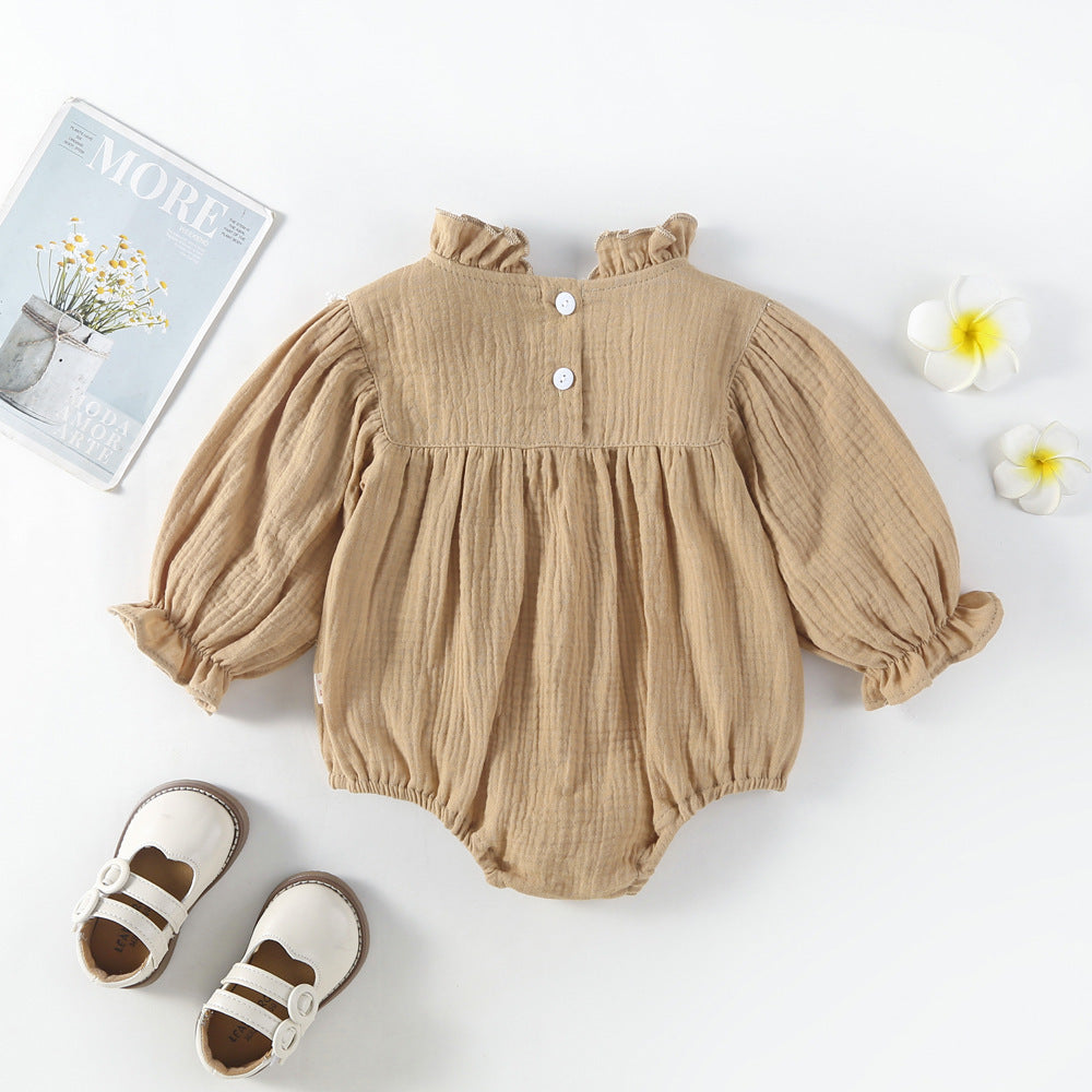 Mocha muslin bubble romper with puff sleeves, flat lay