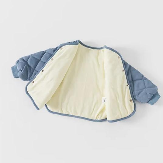 Blue quilted jacket opened to show fleece lining