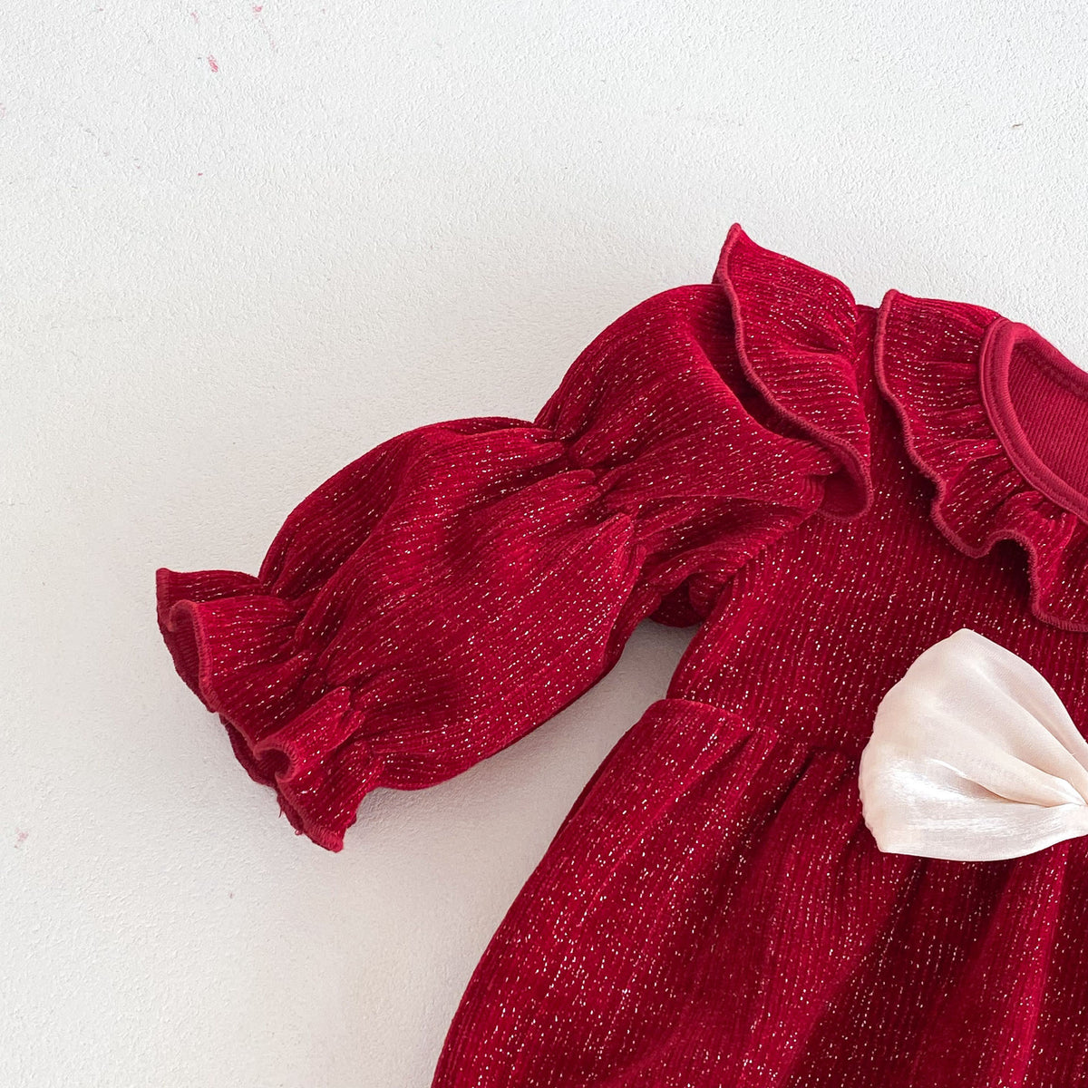Close-up of puff sleeve and bow