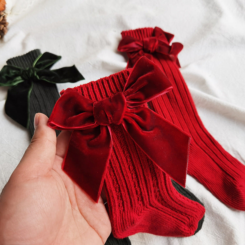 Red ribbed knee socks with big velvet bows