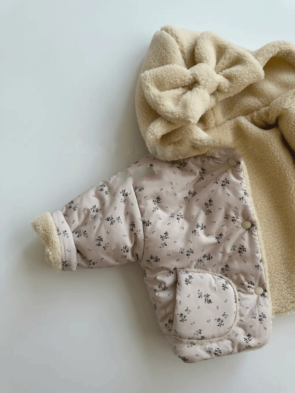 Jacket showing floral reverse side inside