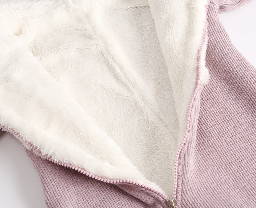 Close-up of sherpa lining inside pink jumpsuit