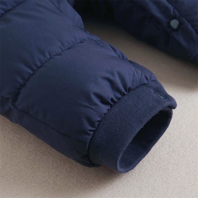 Close-up of ribbed ankle cuff on navy snowsuit