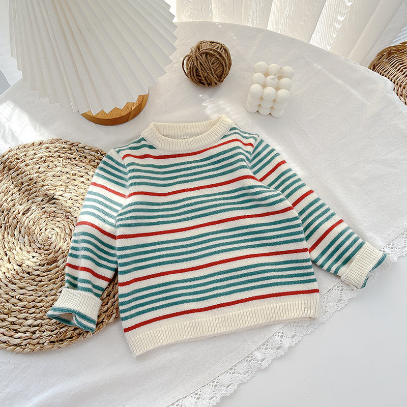 Cream knit baby sweater with teal, red and peach stripes