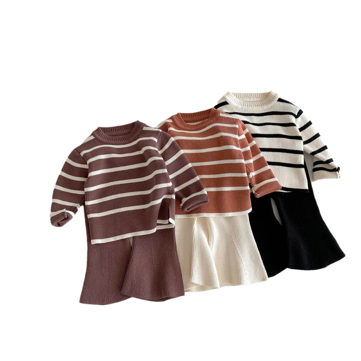 Three striped sweater and flare pants sets on white background